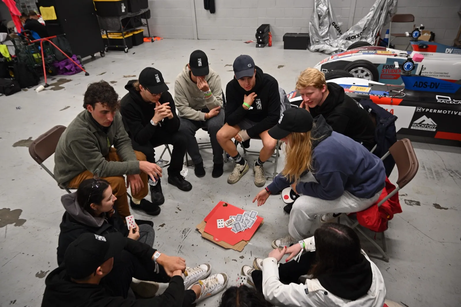Card games in the Silverstone garage next to the car
