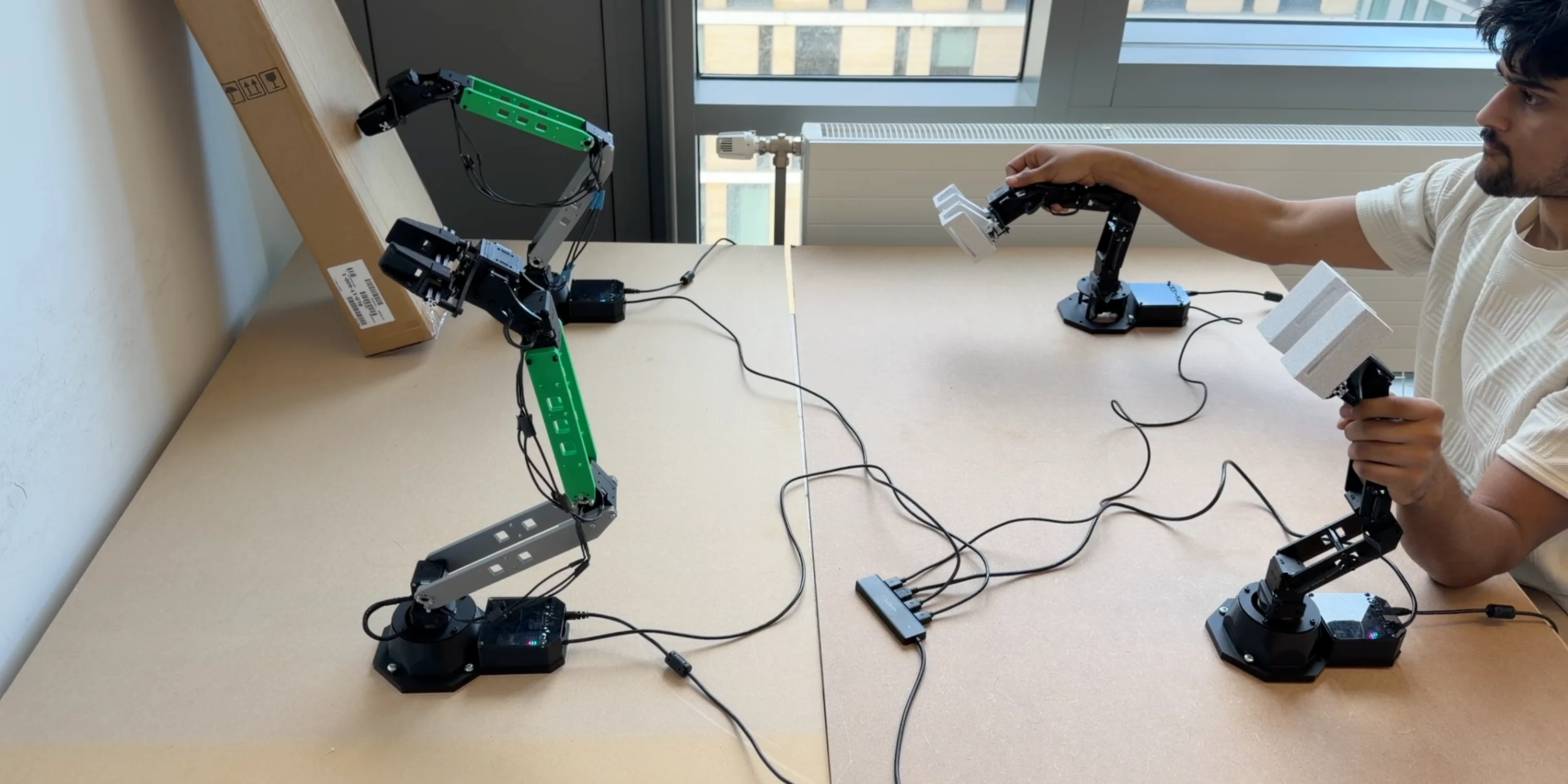 Dual-pair teleoperation system with custom scaled robotic arms